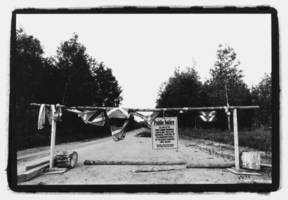 Students blockades  logging truck on Grassy Narrows land, 2002.