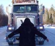 Highschool youth blocks logging trucks, Ontario, 2002